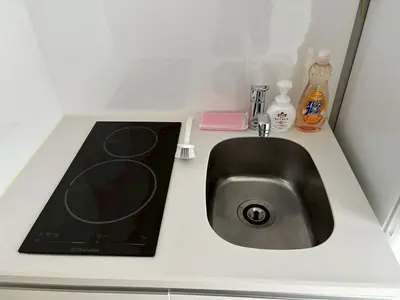 a kitchen counter with a sink in a bathroom at Pure Rest Otsuka 302 JR Otsuka Station in Tokyo