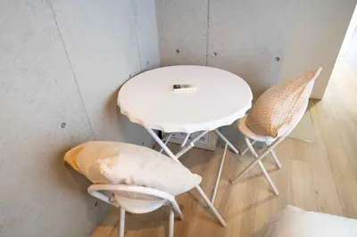 a white table and two chairs in a room at Pure Rest Otsuka 302 JR Otsuka Station in Tokyo
