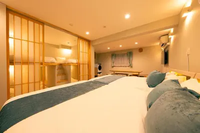 a bedroom with a large white bed in a room at Asakusa Sky Tokyo Condominium hotel in Tokyo