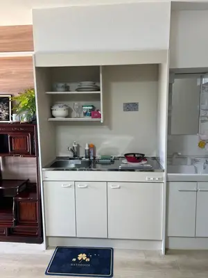 a kitchen with white cabinets and a sink at \u6771\u65b0\u5bbf\u30a8\u30ea\u30a277 in Tokyo