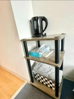 a coffee maker on a shelf in a room at Tokyo Shinjuku Goose Goose Apart in Tokyo