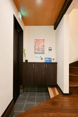 a hallway of a house with a wooden ceiling at Seed INN Iori-\u5eb5- in Tokyo