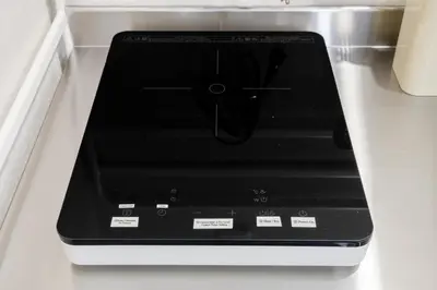 a black stove top oven sitting on top of a counter at Lucky you! SHIBUYA in Tokyo