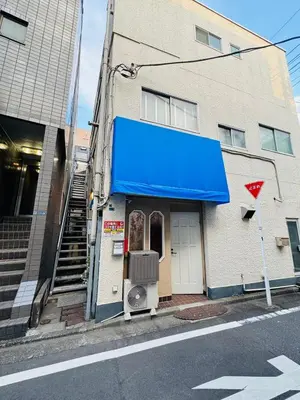 a blue awning on the side of a building at Shinagawa City \u834f\u539f101-SN0479 in Tokyo