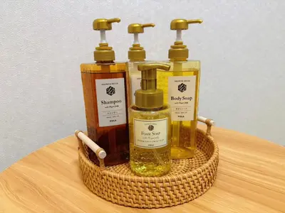 a basket with four bottles of oils on a table at Silvership Hotel 201 in Tokyo