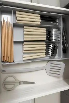 a refrigerator with a container with pasta and a pair of scissors at Retreat BABA in Tokyo