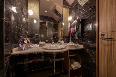 a bathroom with a sink and a large mirror at Charme Hotel, Romantic Hideaway in Central Tokyo in Tokyo
