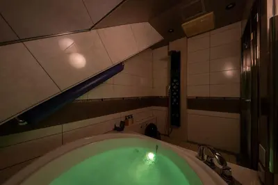a bath tub in a bathroom with a sink at Charme Hotel, Romantic Hideaway in Central Tokyo in Tokyo