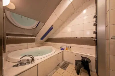 a bathroom with a sink and a mirror at Charme Hotel, Romantic Hideaway in Central Tokyo in Tokyo