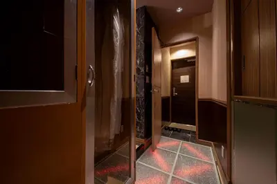 a hallway with a door and a room with a tile floor at Charme Hotel, Romantic Hideaway in Central Tokyo in Tokyo