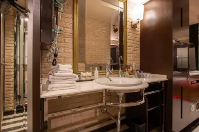a bathroom with a sink and a mirror at Charme Hotel, Romantic Hideaway in Central Tokyo in Tokyo