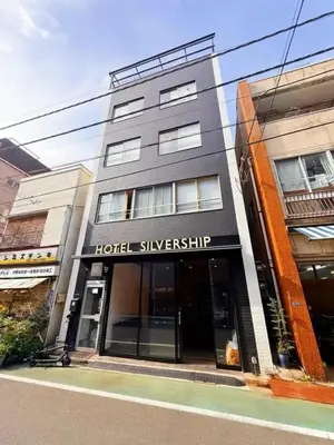 a building with a hotel silverknife sign on it at Silvership Hotel 502 in Tokyo