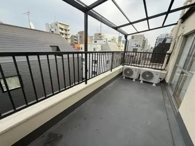 a balcony of a building with two speakers on it at Silvership Hotel 502 in Tokyo