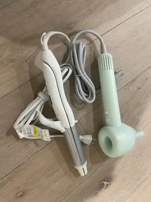 a wii controllers and a remote control on the floor at Green Apple Otsuka 201 in JR Otsuka station in Tokyo