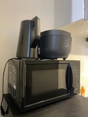 a microwave with a container on top of it at Artessimo\u62bc\u4e0a 401 in Tokyo