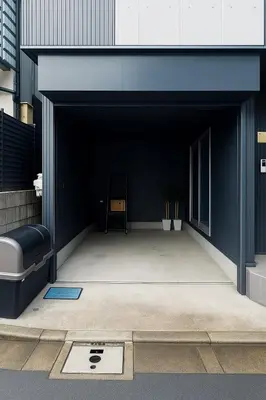 a black garage with a chair inside of it at 30 sec to Station,4min to Skytree,82sqm,Sleeps 8,Free Parking,Close to Akihabara Asakusa Ueno in Tokyo