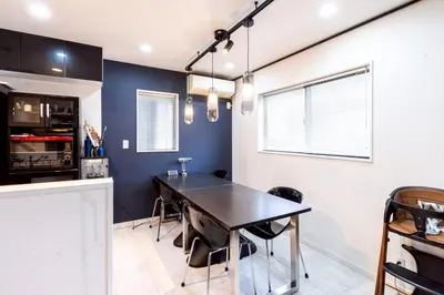 a dining room with a table and a kitchen at 30 sec to Station,4min to Skytree,82sqm,Sleeps 8,Free Parking,Close to Akihabara Asakusa Ueno in Tokyo