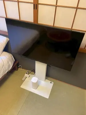 a room with a computer and a monitor and a bed at Asakusa Retreat Designer curated stylish room 1 in Tokyo