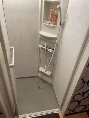 a small refrigerator in a stairway with drinks in it at Asakusa Retreat Designer curated stylish room 1 in Tokyo