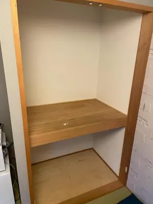 a cupboard in a kitchen with wooden shelves at Asakusa Retreat Designer curated stylish room 1 in Tokyo