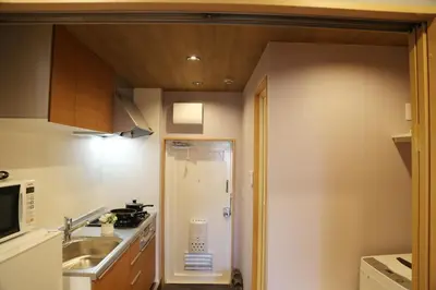 a small kitchen with a sink and a microwave at M207 Easy access to Ikebukuro Red Leaves ,Golden Ginkgo in Tokyo