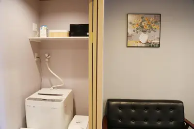 a bathroom with a toilet and a picture on the wall at M207 Easy access to Ikebukuro Red Leaves ,Golden Ginkgo in Tokyo