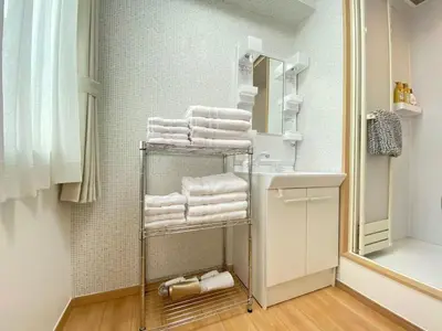 a bathroom with a towel rack with towels at SK - Tokyo Ikebukuro Premium Comfort 4LDK Entire house in Tokyo