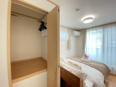 a small bedroom with a bed and a window at SK - Tokyo Ikebukuro Premium Comfort 4LDK Entire house in Tokyo