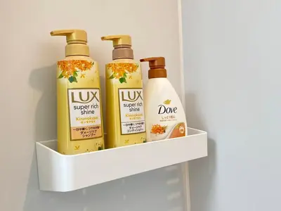 a shelf in a refrigerator with four bottles of hair products at SK - Tokyo Ikebukuro Premium Comfort 4LDK Entire house in Tokyo