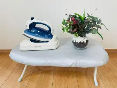 a table with a telephone and a potted plant on it at SK - Tokyo Ikebukuro Premium Comfort 4LDK Entire house in Tokyo