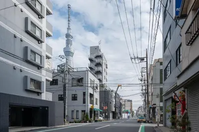 an empty city street with the television tower in the background at \u30eb\u30cd\u30b5\u30f3\u30b9\u30b3\u30fc\u30c8\u672c\u6240\u543e\u59bb\u6a4b in Tokyo