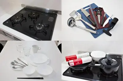 a stove top with plates and utensils on it at \u738b\u5b50\u795e\u8c37\u5e73\u5c4b in Tokyo