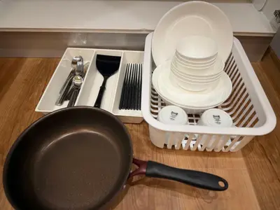 a kitchen counter with a frying pan and dishes at Silvership Hotel 101 in Tokyo