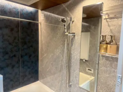 a shower with a glass door in a bathroom at ROLES Ryusen 902 near Asakusa,Ueno,Skytree in Tokyo
