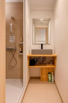 a bathroom with a sink and a mirror at Silvership Hotel 501 in Tokyo
