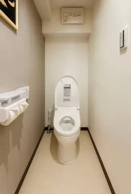 a bathroom with a toilet with the lid up at Silvership Hotel 401 in Tokyo