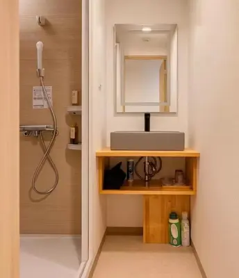 a bathroom with a sink and a mirror at Silvership Hotel 401 in Tokyo
