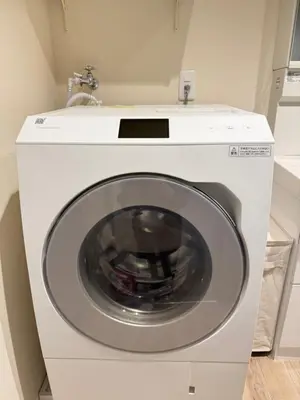 a white washing machine with a sink in a room at Moto Sakura 403,2 bedrooms with 4 beds, 6 people, direct access to Narita and Haneda Airports, Asakusa and Ueno area, 5 train lines available, Bicycles free rental in Tokyo