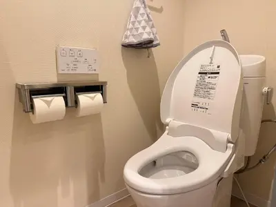 a bathroom with a toilet with two rolls of toilet paper at Moto Sakura 403,2 bedrooms with 4 beds, 6 people, direct access to Narita and Haneda Airports, Asakusa and Ueno area, 5 train lines available, Bicycles free rental in Tokyo