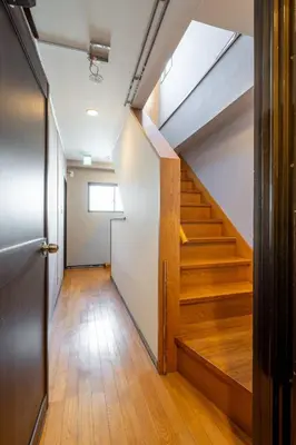 a hallway with stairs in an office building at WA NO YADO-Asakusa Retreat 10 min walk from Asakusa Designer curated stylish room 3 in Tokyo
