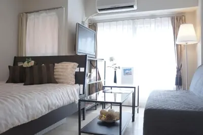a bedroom with a bed and a glass table at #3 Tokyo Shinjuku Shibuya room in Tokyo