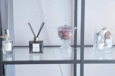 a glass shelf with a vase and other items on it at #3 Tokyo Shinjuku Shibuya room in Tokyo