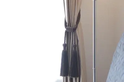a window with a curtain that is tied up at #3 Tokyo Shinjuku Shibuya room in Tokyo