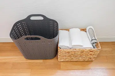 two baskets sitting on the floor with towels at \u83ca\u5ddd\u99c5\u5f92\u6b69\u516d\u5206 Zaito Kiku House in Tokyo