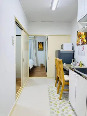 a kitchen with a desk and a table with a chair at Shinagawa City \u834f\u539f201-SN0480 in Tokyo