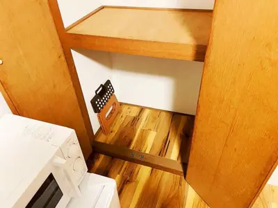 an overhead view of a kitchen with a stove at KYM Heights in Tokyo