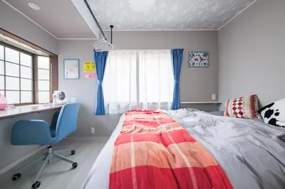 a bedroom with a bed and a desk and a chair at JJ HOUSE Omori Heiwajima - Near Shinagawa Haneda Airport - Japanese Style Room - Floor Heating System in Tokyo