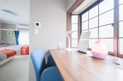 a bedroom with a desk with a computer and a bed at JJ HOUSE Omori Heiwajima - Near Shinagawa Haneda Airport - Japanese Style Room - Floor Heating System in Tokyo