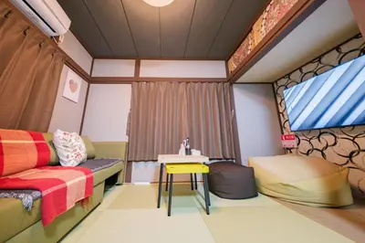 a room with a bed and a sink and a table at JJ HOUSE Omori Heiwajima - Near Shinagawa Haneda Airport - Japanese Style Room - Floor Heating System in Tokyo