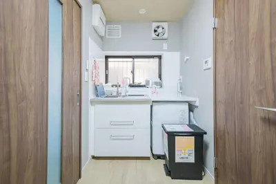 a small kitchen with a sink and a window at JJ HOUSE Omori Heiwajima - Near Shinagawa Haneda Airport - Japanese Style Room - Floor Heating System in Tokyo